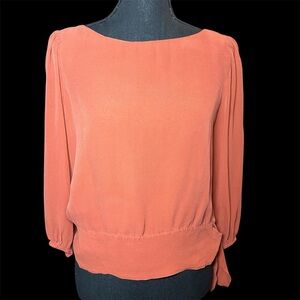 Bebe small orange balloon sleeve blouse